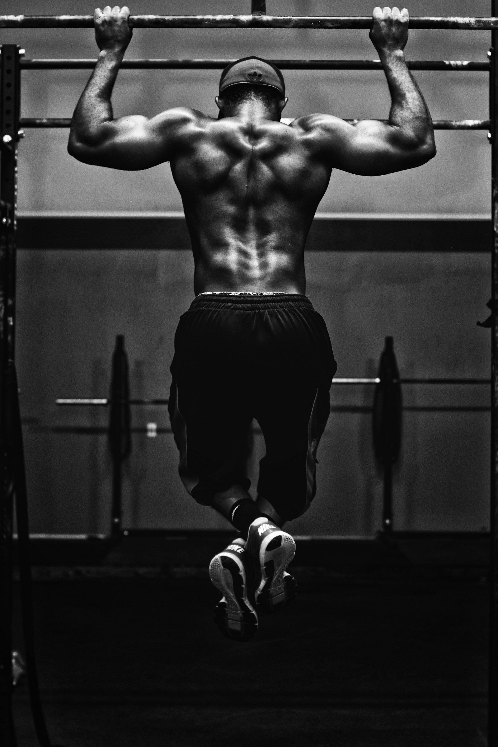 Black-and-white pull-up showing a strong back and full focus